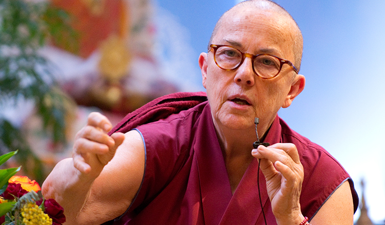 A Buddhist nun is talking in a mic